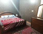 اتاق خواب با تخت و کمد چوبی 4565521144